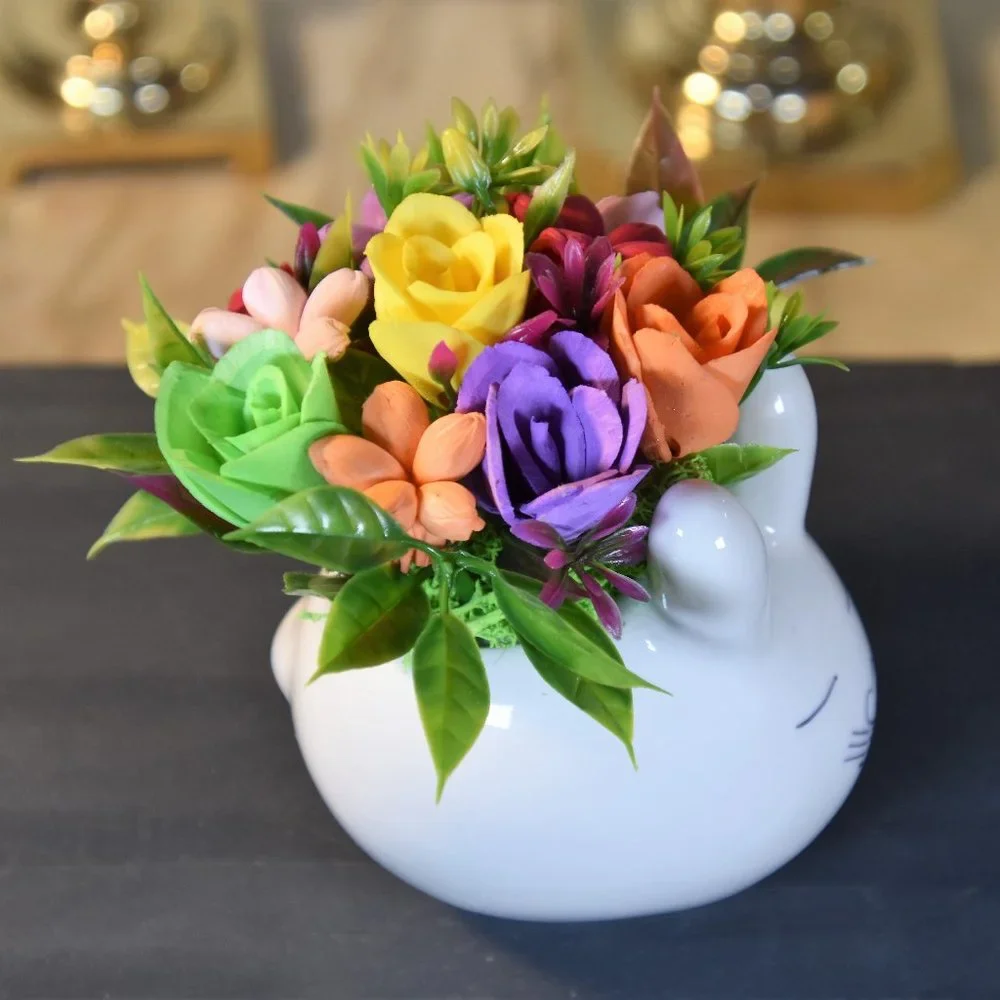 Cute small bunny rabbit planter filled small Sola flowers dyed in bright colors